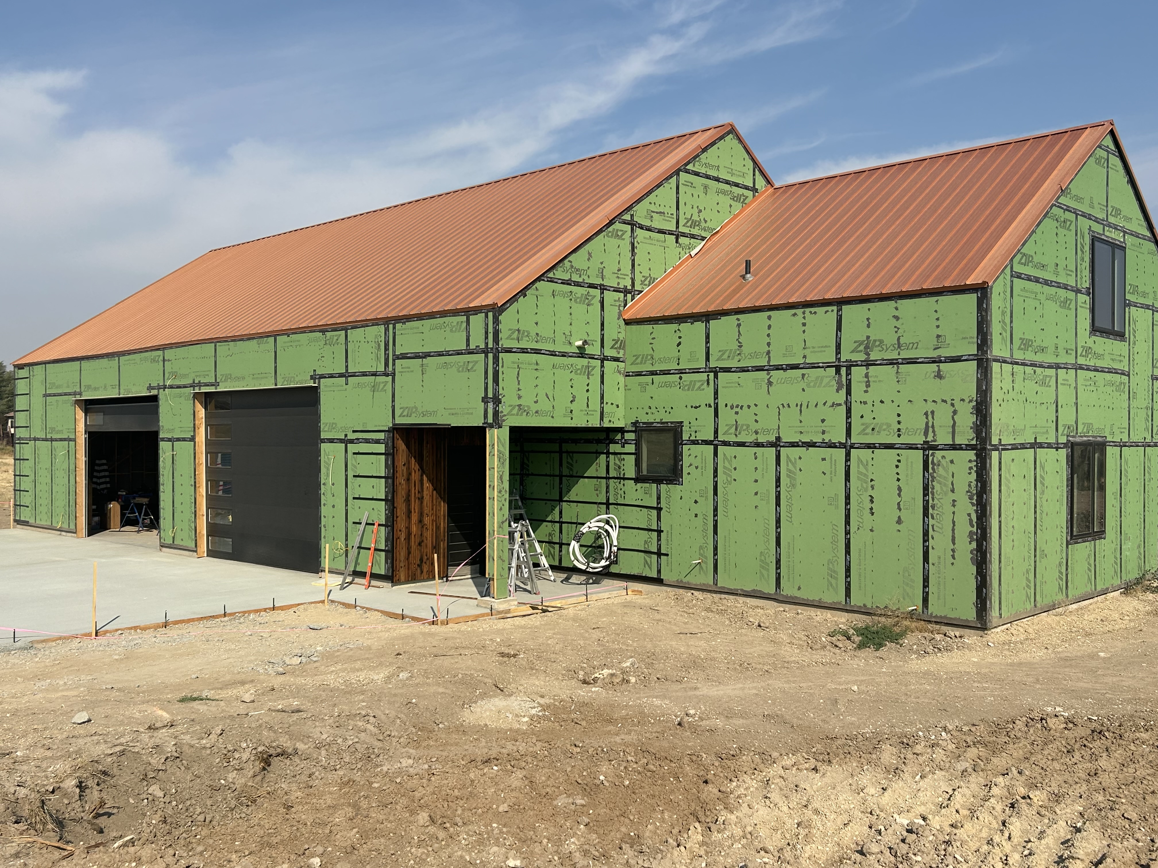 Green ZIP System sheathing on large shop and home combination